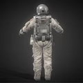 Man In Detailed White Astronaut Suit Standing Against Dark Background