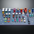Various Colorful Different Types of Toy Cars Arranged on Simulated Road Tray