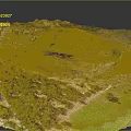 Vibrant Natural Terrain With Green Vegetation Rocky Outcrops And Varied Landforms