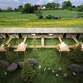 Scenic Mountain Homestay Architecture With Wooden Structure And Lush Green Forest