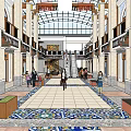 Shopping Mall Atrium With Glass Skylight Columns Staircase Shop Fronts And Shoppers Walking