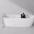 Modern Minimalist Freestanding White Bathtub With Silver Faucet Black Tray And Bath Products