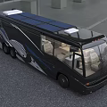 Black Motorhome With Solar Panels On Roof Blue Accents And Beige Seats Interior