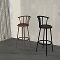 Two Modern Bar Stools With Brown And Black Leather Seats And Metal Frames Indoor