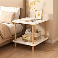 Cozy Bedroom Side Table With White Top Wooden Legs Books Photo Frame And Storage Basket