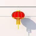 Red Lantern Household Item With Yellow Tassels Hanging On Black Pole White Wall With Shadow