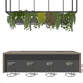 Modern Bar Counter With Hanging Trailing Greenery And Four Gray Stools