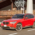 Red BMW SUV Exterior View Parked On Road With Building Background