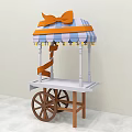 Colorful Candy Cart With Blue Orange Striped Canopy And Orange Bow