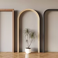 Three Different Colored Door Arches With Potted Plant On Wooden Herringbone Floor