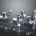 Shiny Stainless Steel Pipe Fittings With Tees Elbows And Reflective Surface On Dark Background