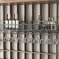 Stylish Wine Cabinet With Wine Bottles And Hanging Wine Glasses On Decorative Metal Rack
