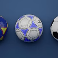 Three Soccer Balls in Blue Yellow Blue White and Black White Colors on Blue Background