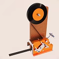 Vintage Mechanical Device With Wooden Base And Black Disc Wheel