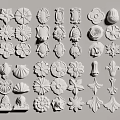 Various Intricate Carved Decorative Elements In White With Floral And Leaf Designs