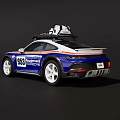 Porsche 953 Blue And White Sports Car With Roof Mounted Equipment And Racing Stripes