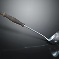 Stainless Steel Cutlery Set With Wooden Handle Ladle On Dark Reflective Surface