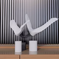 Modern White Abstract Bird Ornament Decor Set On Wooden Tabletop With Dark Vertical Stripe Wall