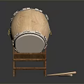 Brass Musical Drum With White Drumhead On Wooden Stand And Emblem