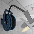 Commercial Kitchen Wall Mounted Hose Reel With Black Tube On White Tiled Wall