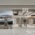 Modern Clothing Store Interior With UFO Signage Wall Poster Mannequins And Clothing Displays