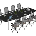 Black Conference Table With Wheeled Office Chairs Green Plants Laptop Documents And Tissue Box