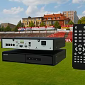 Black Audio System Players Stack With Remote Control On Stadium Grass