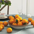 Round Dining Table Set With Striped Tablecloth Fruits Plants And Wooden Chairs With Woven Seats