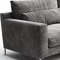 Gray Velvet Two Seater Sofa Upholstered with Soft Pillows and Cozy Knit Blanket