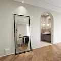 Modern Living Dining Room With Black Sofa TV Rug Bean Bag And Arched Doorway