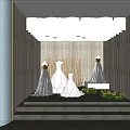 Bridal Shop Interior With Wedding Dress Mannequins On Steps Flower Bouquets And Lighting