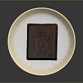 Decadent Chocolate Cake Served On Ornate White Plate With Gold Patterns