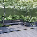 Lush Green Landscape Wall In Outdoor Space With Trees Ferns Bench And Paved Ground