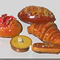 Assorted Baked Goods With Strawberry Topped Bread Sugar Sprinkled Loaf Croissant Butter Tart And Éclair