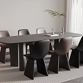 Modern Black Brown Dining Table Set With Chairs Green Plant And Book