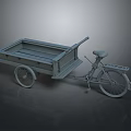 Gray Cargo Bicycle With Open Metal Cart And Single Rear Wheel Design