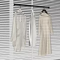 Light Colored Clothes In Various Styles With Lace Details Hanging On Hangers