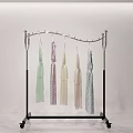 Metal Clothing Rack With Wheels Holding Light Colored Garments In Minimalist Space