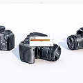 Three Black Digital Cameras With Different Angles And Body Design Features 3d model