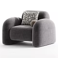 Modern Beige Single Sofa With Black And White Geometric Pillow And Brown Decorative Ball