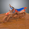 Muddy Blue And Red Off Road Motorcycle With Number 36 On Dirt Terrain
