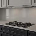 Modern Kitchen Interior With Sleek Gas Stove Light Countertop And Grey Cabinets