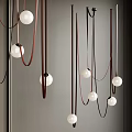 Modern Minimalist Pendant Lights With White Spherical Shades Brown Black Hanging Cords And Sleek Design