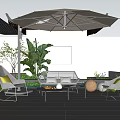 Outdoor Leisure Sofa Set with Umbrella Plants and Tables on Patio