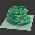 Neatly Coiled Green Cable With Red Ends Placed On Gray Mat
