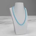 Turquoise Beaded Jewelry Necklace Display on White Mannequin with Marble Surface