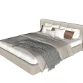 Modern Double Bed with Light Colored Headboard White and Brown Pillows and Gray Blanket