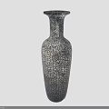 Fresh Green Plants Displayed In Slender Gray Black Crackle Textured Vase