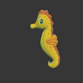 Yellow And Red Seahorse Toy With Orange Fins On Black Background