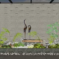 Garden Ornament Featuring Gray Wall Triangular Patterns Crane Sculptures Green Plants Water Feature and Pebbles